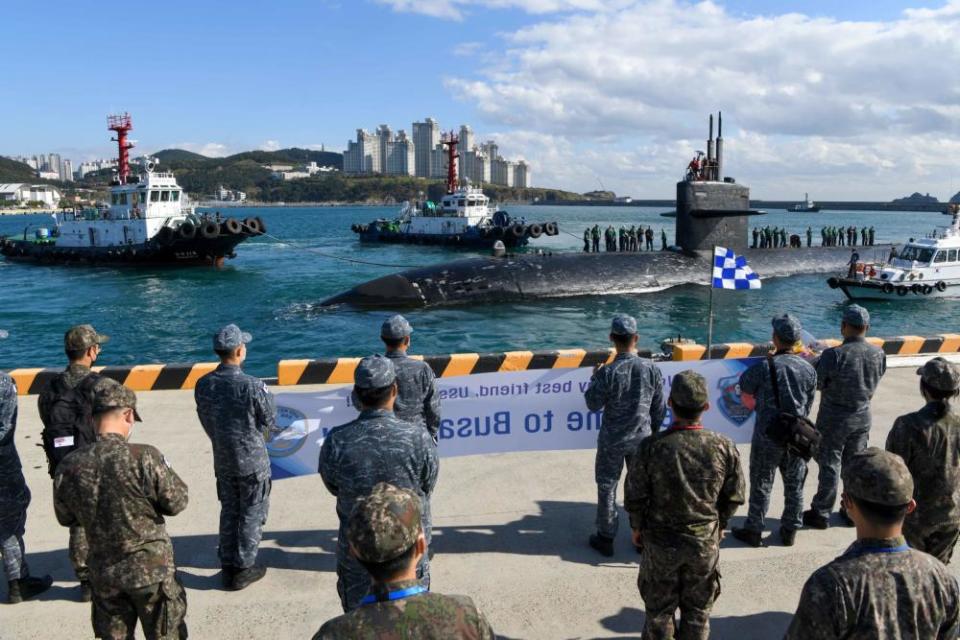 The Republic of Korea Navy sailors welcome the USS Key West as the ship prepares to moor in Busan, South Korea on Oct. 31. The sub completed its final deployment in November after serving the country for more than 35 years.