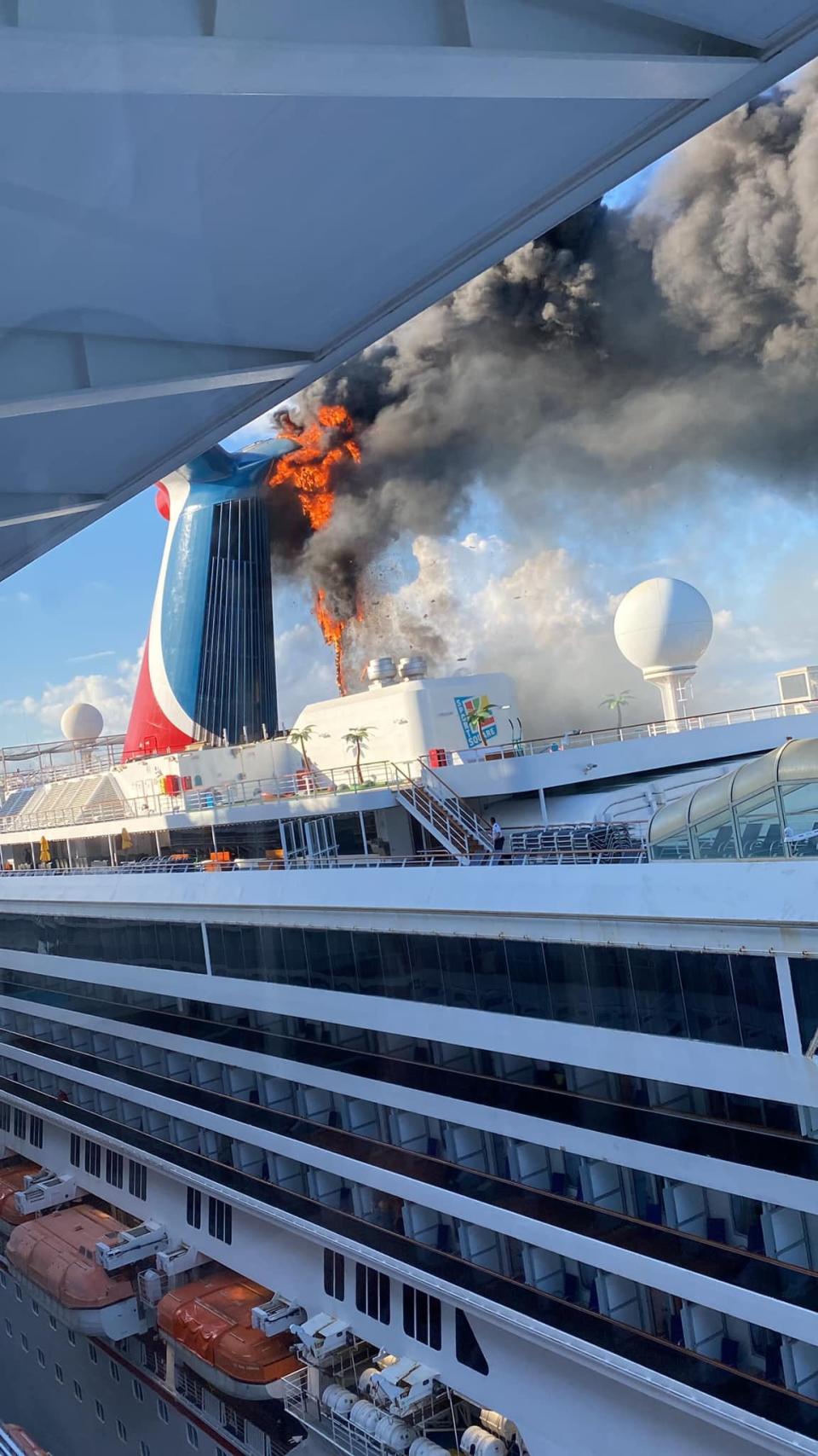 Katie Bushnell took this photo of the funnel fire on the Carnival Freedom while she was aboard Carnival's Mardi Gras in an adjacent cruise berth at Grand Turk.