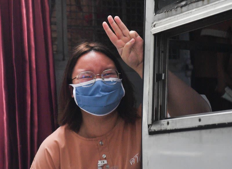 Arrested anti-government protesters arrive at criminal court to face lese majeste charges in Bangkok