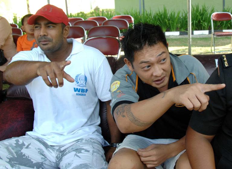 Convicted Australian drug smugglers Myuran Sukumaran (L) and Andrew Chan (R) inside Kerobokan prison in Denpasar, Bali on August 17, 2010
