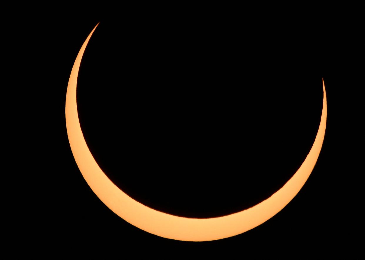 The moon crosses in front of the sun over Albuquerque, New Mexico, during an annular eclipse on October 14, 2023.