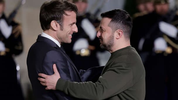 PHOTO: French President Emmanuel Macron, left, welcomes Ukrainian President Volodymyr Zelenskyy at the Elysee Palace before a working diner with German Chancellor Olaf Scholz, Wednesday, Feb. 8, 2023 in Paris. (Lewis Joly/AP)