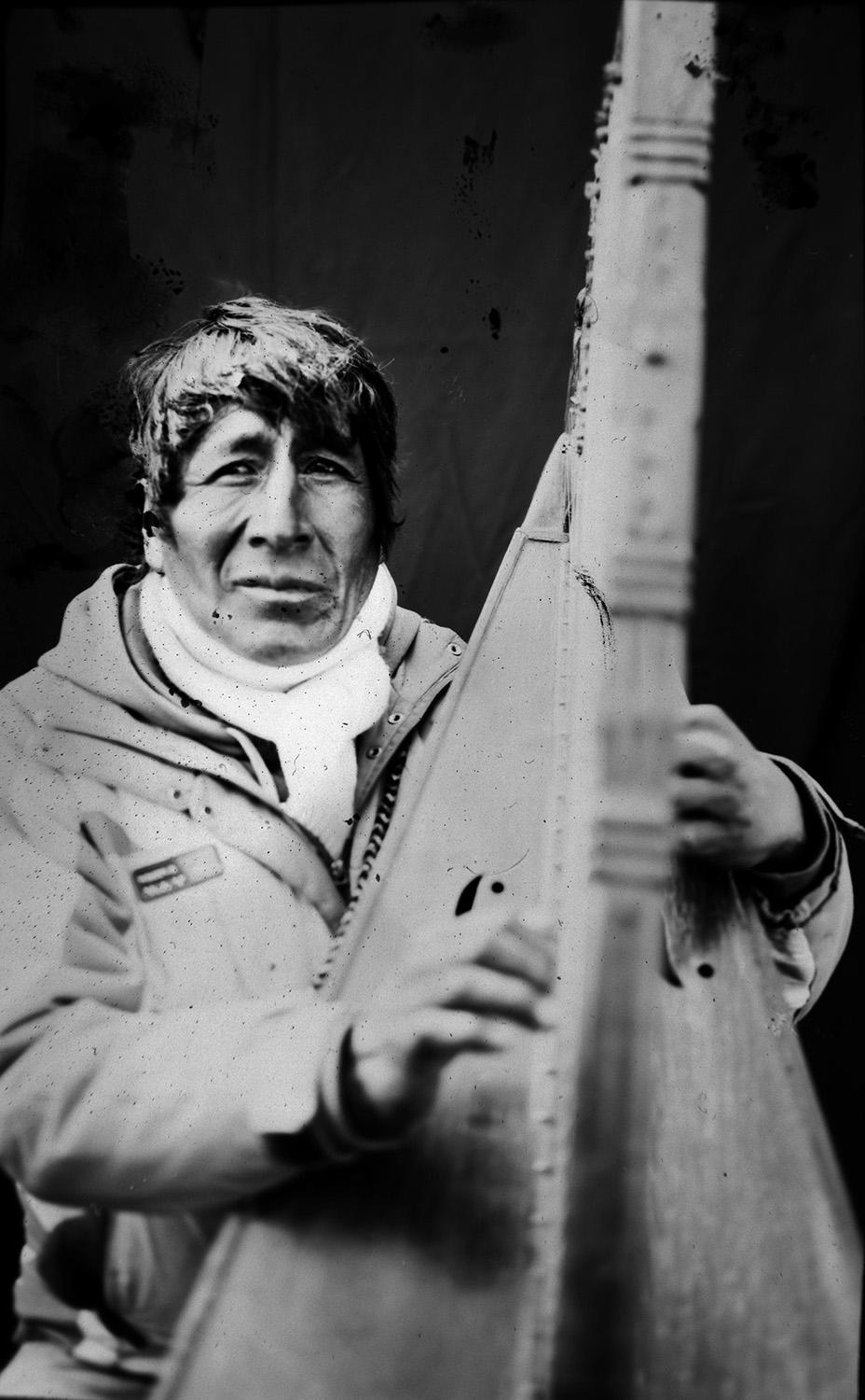 <p>Contract musician Eulogio Quispe, 54, poses for a portrait with his Peruvian harp, in the Sinakara Valley, in Peru’s Cuzco region, during the Qoyllur Rit’i festival, translated from the Quechua language as Snow Star. The Peruvian variation of the harp has no pedals. (Photo: Rodrigo Abd/AP) </p>