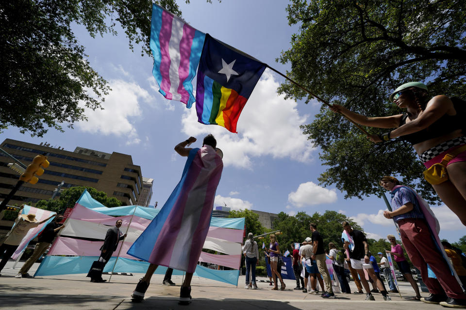 FILE - In this Thursday, May 20, 2021 file photo, demonstrators gather on the steps to the State Capitol to speak against transgender-related legislation bills being considered in the Texas Senate and Texas House in Austin, Texas. Pride Month celebrations in the U.S. are taking place under unusual circumstances in June 2021, with pandemic-related concerns disrupting many of the usual festivities and political setbacks dampening the mood of LGBTQ-rights activists. (AP Photo/Eric Gay, File)