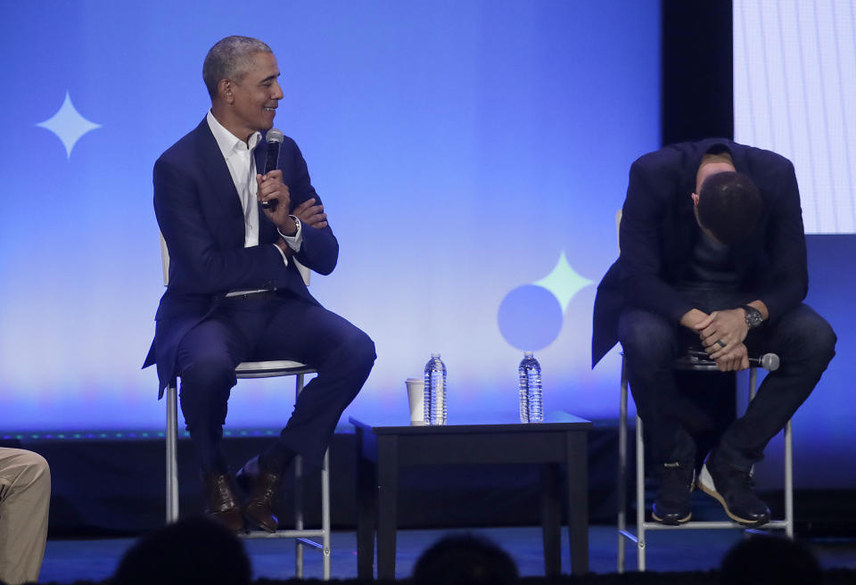 Golden State Warriors basketball player Stephen Curry, right, laughs while former President Barack Obama, speaks at the My Brother's Keeper Alliance Summit in Oakland, Calif., Tuesday, Feb. 19, 2019. (AP Photo/Jeff Chiu)