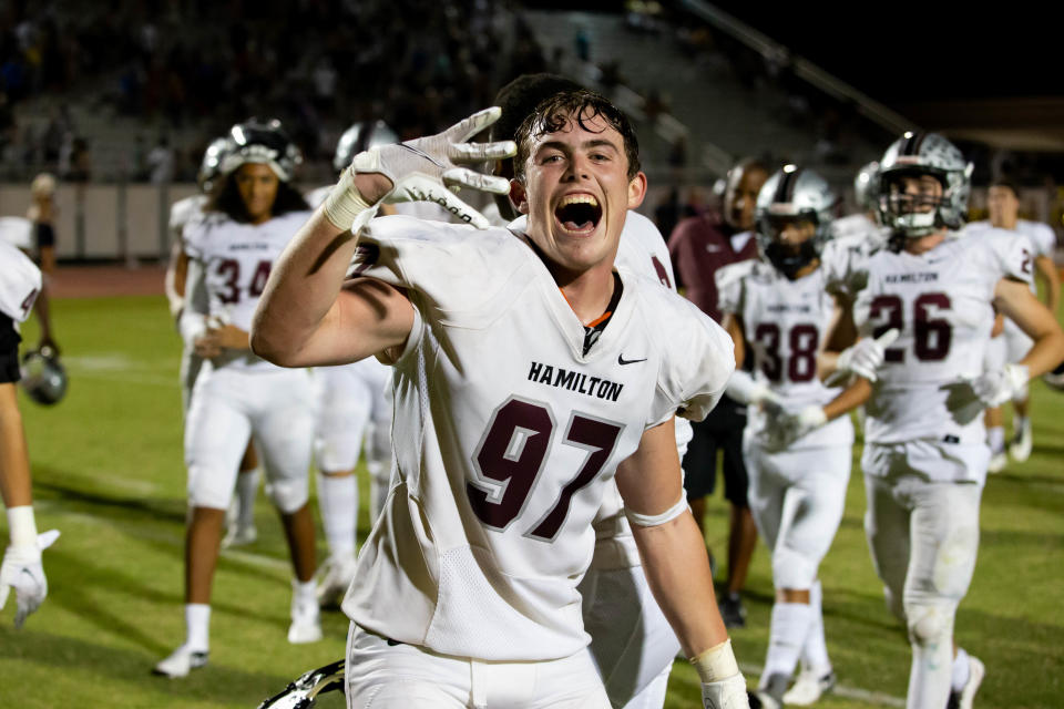 Chandler Davis celebrates after a Hamilton win, Friday, Sept. 10, 2021 at Casteel High School in Queen Creek, Ariz.