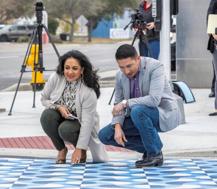 Corpus Christi Mayor Paulette Guajardo and Councilman Ben Molina admire the new artistic crosswalk at the Six Points intersection.