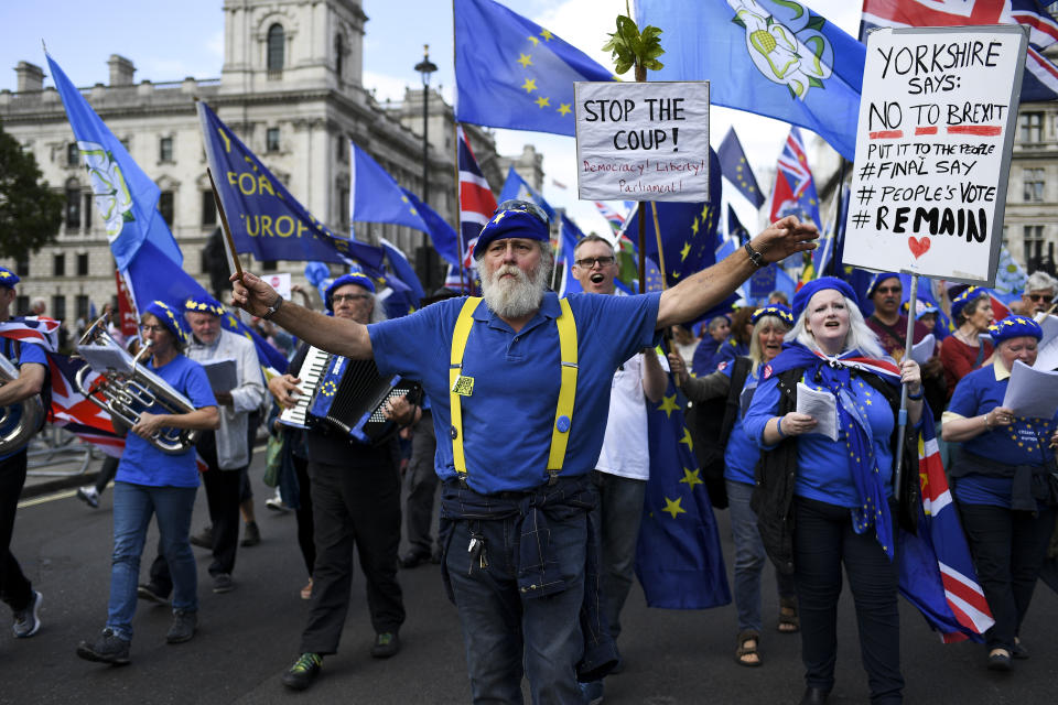 Anti Brexit demonstrators gather and march at Parliament Square, in London, Tuesday, Sept. 3, 2019. Lawmakers returned from their summer recess Tuesday for a pivotal day in British politics as they challenged Prime Minister Boris Johnson's insistence that the U.K. leave the European Union on Oct. 31, even without a withdrawal agreement to cushion the economic blow. (AP Photo/Alberto Pezzali)