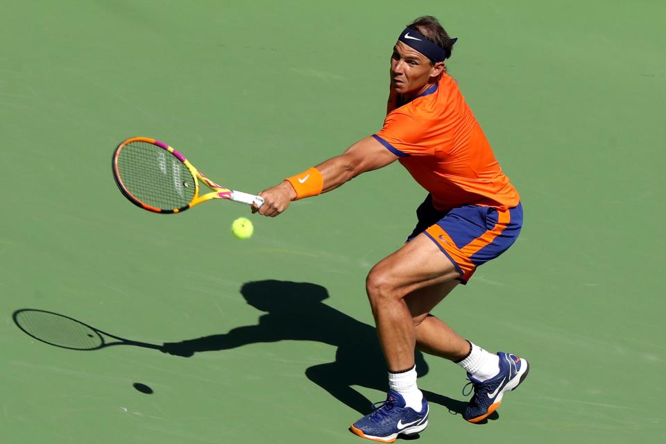 Rafael Nadal of Spain hits a return to Reilly Opelka of the United States during the BNP Paribas Open in Indian Wells, Calif., on Wednesday, March 16, 2022. 