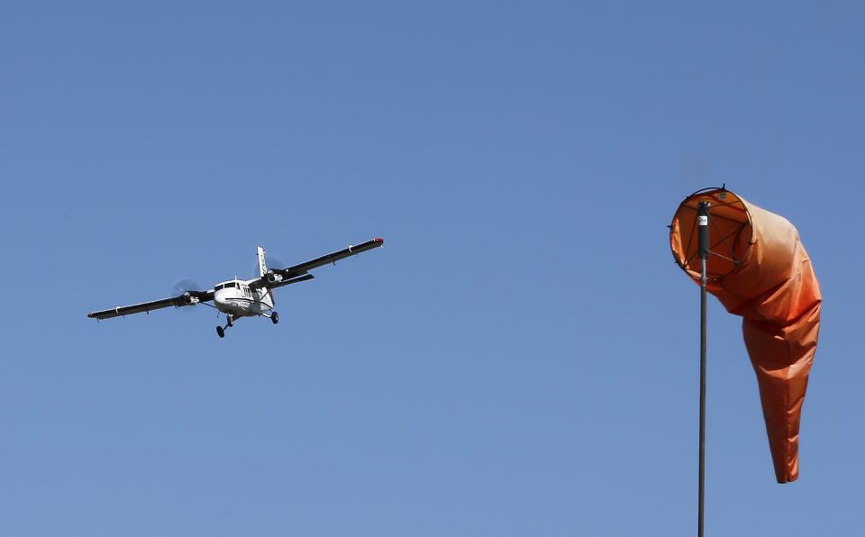 In this Oct. 11, 2013 photo, a tour plane comes in for a landing at Grand Canyon National Park Airport in Tusayan, Ariz. Air tour operators that use aircraft with quiet technology will be able to fly more people over the Grand Canyon. The Federal Aviation Administration said it plans to release 1,721 flight allocations this year that had been abandoned to those commercial tour operators, as long as their active fleet doesn't increase noise in the park overall. (AP Photo/Ross D. Franklin)