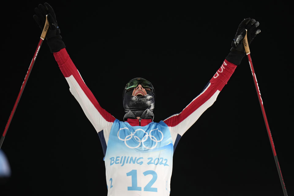 Norway's Joergen Graabak celebrates after winning the gold medal during the cross-country skiing portion of the individual Gundersen large hill/10km competition at the 2022 Winter Olympics, Tuesday, Feb. 15, 2022, in Zhangjiakou, China. (AP Photo/Alessandra Tarantino)