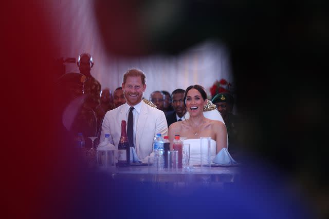 <p>KOLA SULAIMON/AFP via Getty </p> Prince Harry and Meghan, Duchess of Sussex attend a reception in Abuja, Nigeria, on May 11, 2024