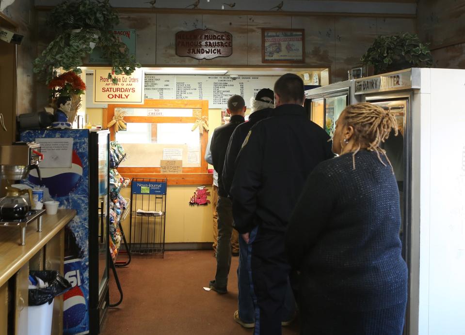 Customers wait in line to order at Helen's Sausage House near Smyrna.