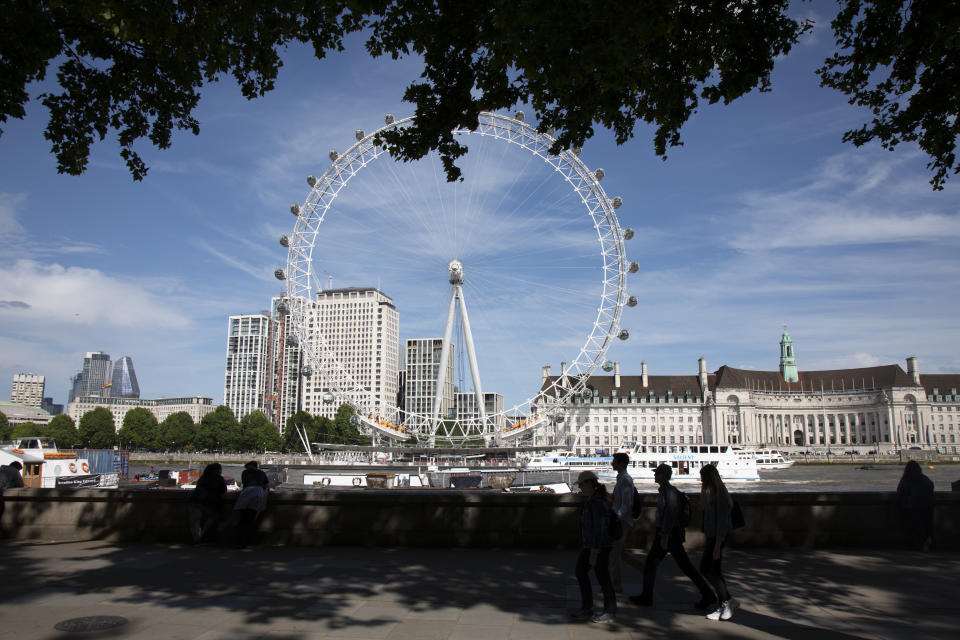 Tourists walk in silhouette across the river from the London Eye, one of the most famous landmarks, skylines and iconic buildings in the capital in London, England, United Kingdom. London Eye, also known as the Millennium Wheel. (photo by Mike Kemp/In Pictures via Getty Images Images)