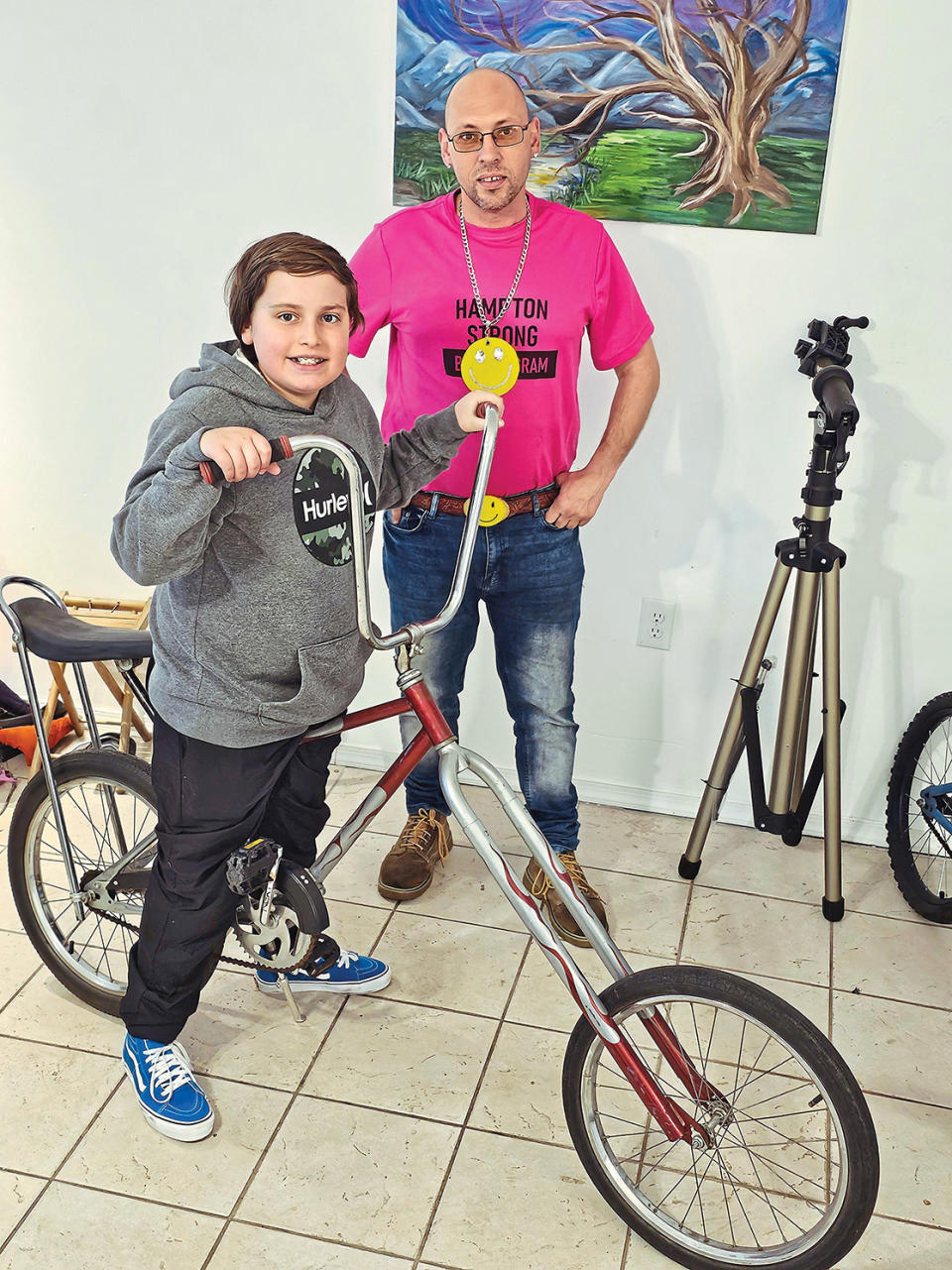 Jeff with a happy recipient of one of the dozens of refurbished bikes he’s given away