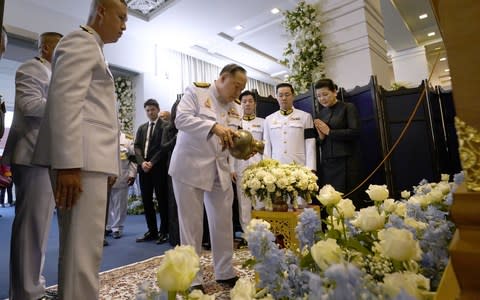 Thai Deputy Prime Minister Prawit Wongsuwan (centre) attends Vichai Srivaddhanaprabha's funeral - Credit: afp