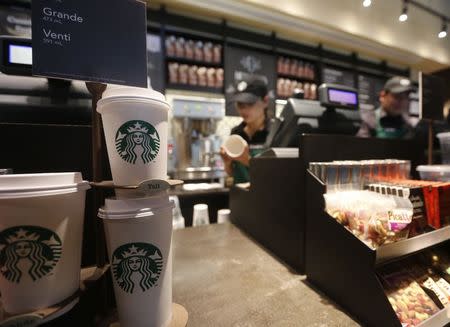 Paper cups of different sizes are seen on display at Starbuck's first Colombian store at 93 park in Bogota July 16, 2014. REUTERS/John Vizcaino