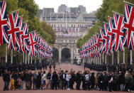 <p>Mourners arrived early in the morning to line up along The Mall near Buckingham Palace ahead of the Queen's state funeral. (Getty)</p> 