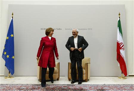 European Union foreign policy chief Catherine Ashton (L) leaves with Iranian Foreign Minister Mohammad Javad Zarif after a photo opportunity before the start of two days of closed-door nuclear talks at the United Nations European headquarters in Geneva November 7, 2013. REUTERS/Denis Balibouse