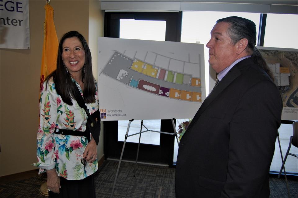 U.S. Rep. Teresa Leger Fernandez and San Juan College Executive Vice President Ed DesPlas examine architectural drawings of the institution's planned student health center during an April 11 press conference at the school's Cultural Center.