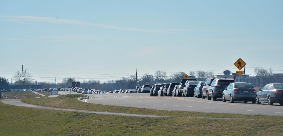 Cars line the length of Crayton Boulevard from Showalter Road on Jan. 4, 2022, waiting to go to the COVID-19 drive-thru testing center at Meritus Medical Plaza.