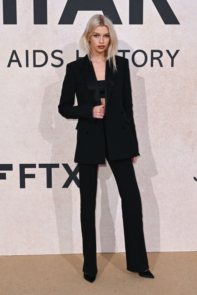 Stella in a pantsuit with long jacket and tube top