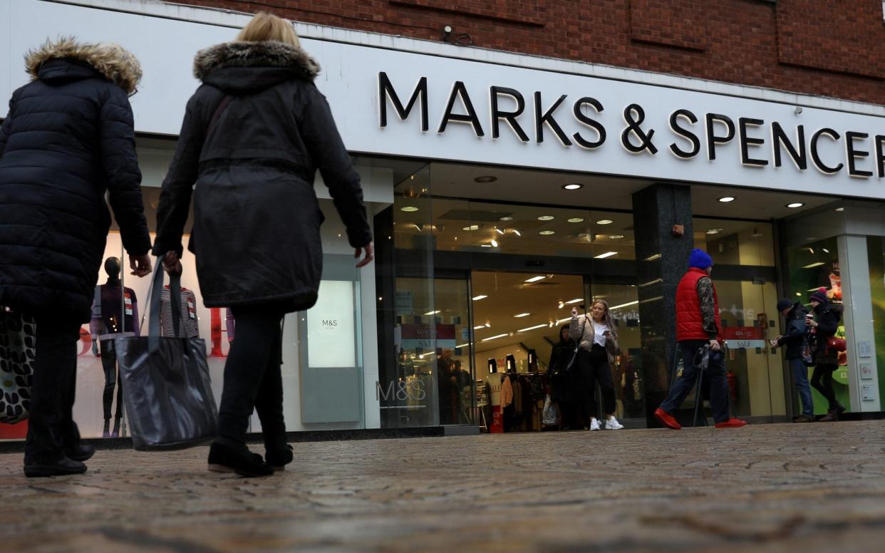 FILE PHOTO: Shoppers walk past a branch of Marks and Spencer in Altrincham, Britain January 7 2020. REUTERS/Phil Noble/File Photo - PHIL NOBLE/REUTERS