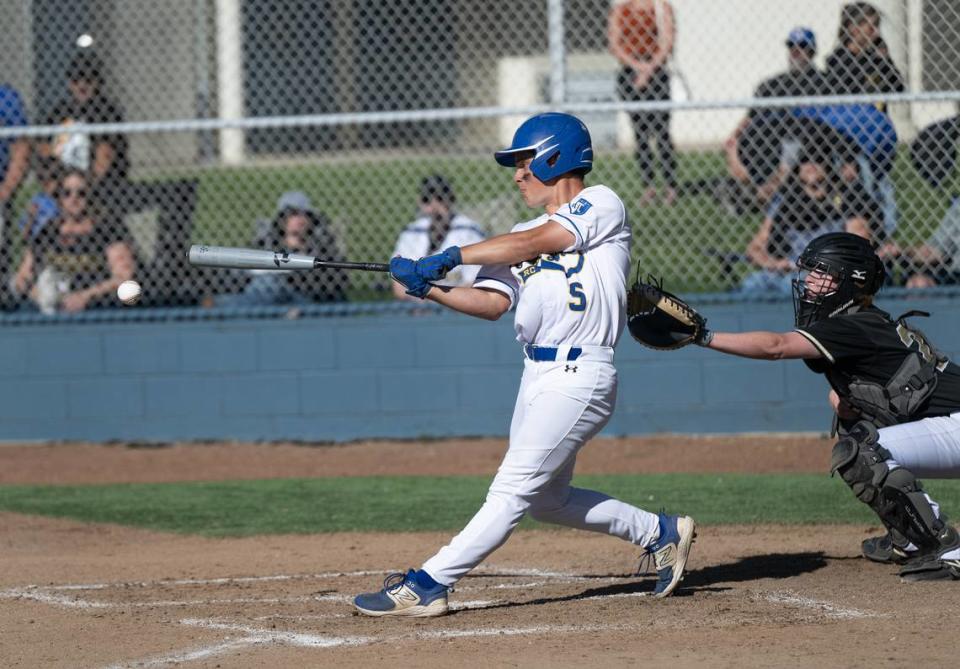 Ripon Christian’s Noah DeBruyn hits a RBI single during the Sac-Joaquin Section Division VI playoff game with Millennium of Tracy in Ripon, Calif., Wednesday, May 8, 2024.