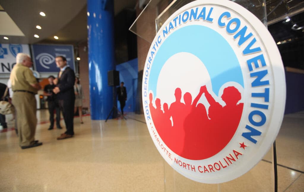 A logo is seen near where workers construct modifications to the Time Warner Cable Arena in preparation for the Democratic National Convention (DNC) on August 22, 2012 in Charlotte, North Carolina. (Photo by Mario Tama/Getty Images)