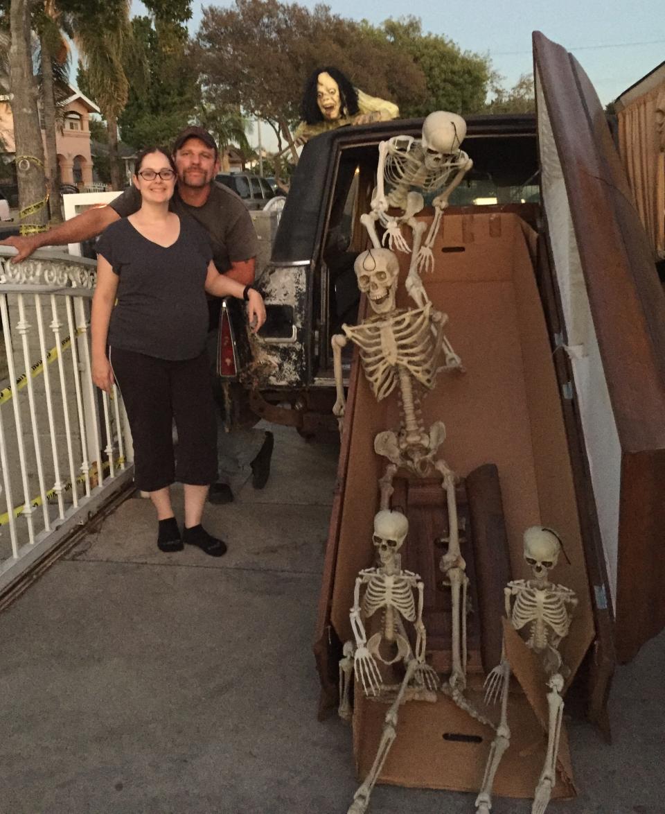 A pregnant Louise and Dan standing beside their hearse in 2015 (Collect/PA Real Life)