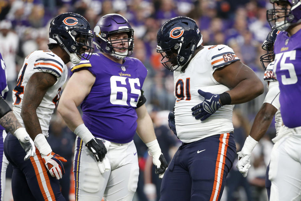 Chicago Bears nose tackle Eddie Goldman (91) celebrates in front of Minnesota Vikings center Pat Elflein (65) after a sack during the first half of an NFL football game, Sunday, Dec. 30, 2018, in Minneapolis. (AP Photo/Bruce Kluckhohn)