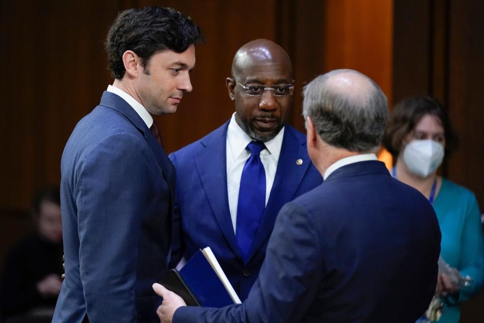 Former Sen. Doug Jones, D-Ala., right, talks with Sen. Jon Ossoff, D-Ga., left, and Sen. Raphael Warnock, D-Ga., center, as they arrive for a Senate Judiciary Committee confirmation hearing for Supreme Court nominee Ketanji Brown Jackson on Capitol Hill in Washington, on March 23, 2022.