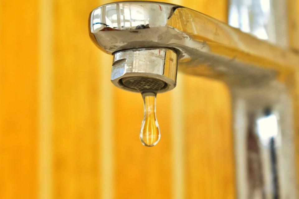 Faucet slowly dripping with water