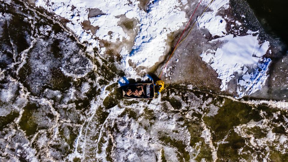 Rescue personnel from the Bolivar and Mineral City fire departments tow duck hunters ashore after they got stuck on the ice of the Tuscarawas River on Jan. 29 at Wilkshire Golf Course in Lawrence Township. According to the Tuscarawas County Sheriff's Office, a passerby called in the incident.