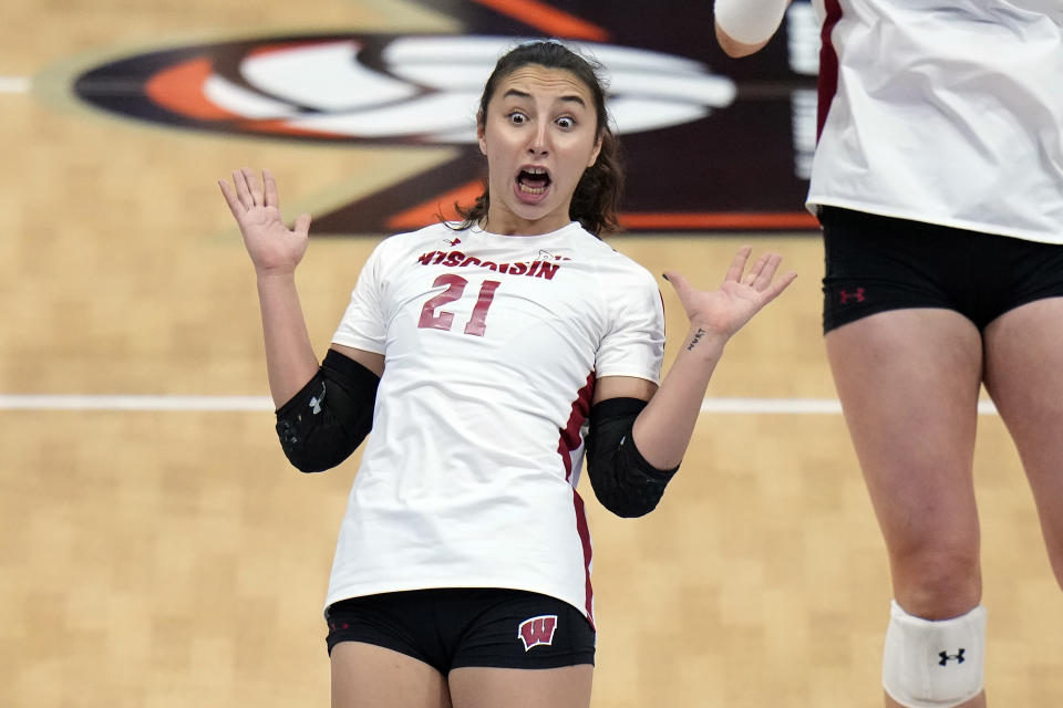 Wisconsin's Gulce Guctekin (21) reacts as the ball goes out of bounds against Texas during a semifinal match in the NCAA Division I women's college volleyball tournament Thursday, Dec. 14, 2023, in Tampa, Fla. (AP Photo/Chris O'Meara)