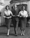 <p>Princess Alexandra is pictured here in the garden of the Kent family home, Coppins, in the village of Ivers. She links arms with her brother Prince Edward, who became the Duke of Kent upon his father's tragic death in a flying crash in 1942. On the far right is their mother Marina, Duchess of Kent and Princess of Greece.</p>