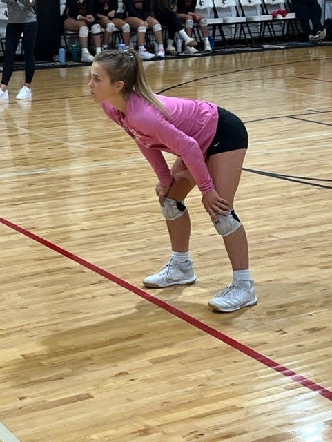 Jupiter Christian libero Reese McNew prepares to return serve against Highlands Christian on Tuesday night in Jupiter.