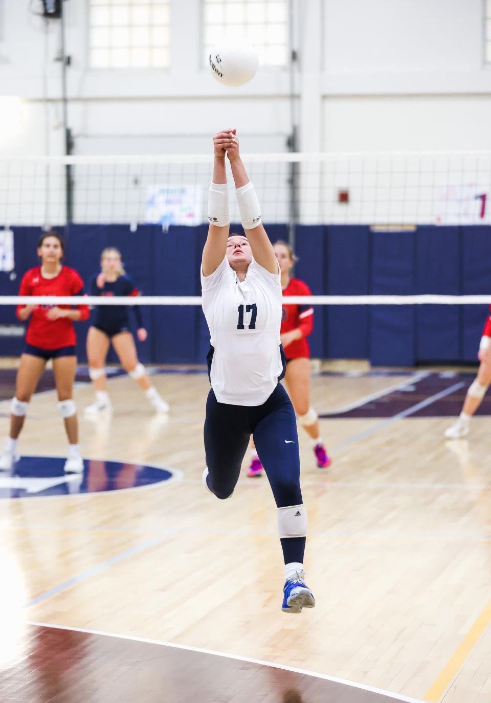 Wilmington Friends' Jocelyn Nathan chases a ball and keeps it in play against Newark Charter.