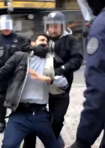 The scandal erupted Wednesday when French daily Le Monde published a video taken by smartphone showing Benalla, wearing a riot police helmet and surrounded by officers, manhandling and striking a protester during a May 1 demonstration