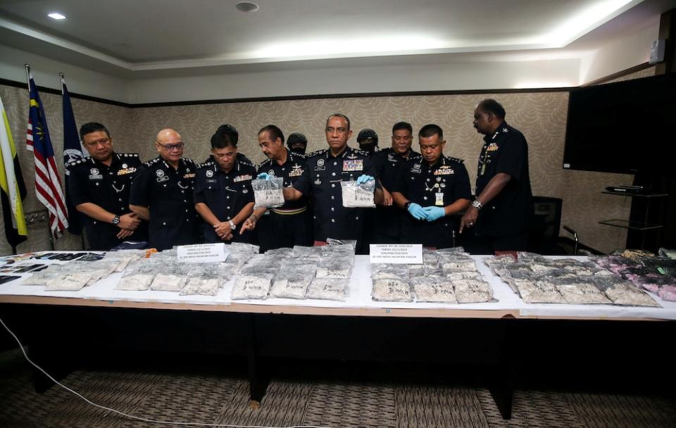 Bukit Aman Narcotics Crime Investigation Department (NCID) director Commissioner Datuk Mohd Khalil Kader Mohd showing the seized drugs at the Perak Police Headquarters in Ipoh, November 25, 2019. — Picture by Farhan Najib