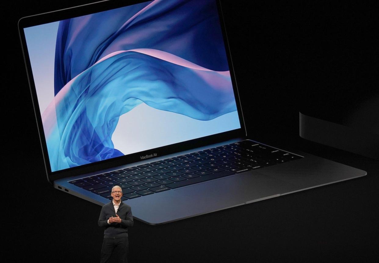 Apple CEO Tim Cook presents new products, including new Macbook laptops, during a special event at the Brooklyn Academy of Music: TIMOTHY A. CLARY/AFP/Getty Images