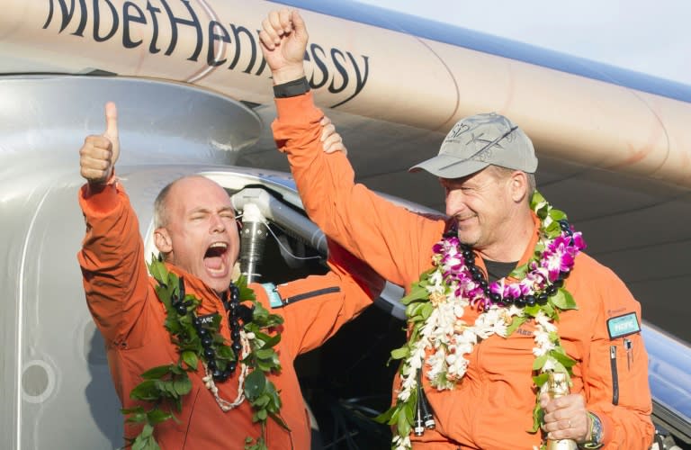 Solar Impulse 2 pilot Bertrand Piccard (L) and pilot Andre Borschberg celebrate after Borschberg landed at Kalaeloa Airport, Hawaii on July 3, 2015