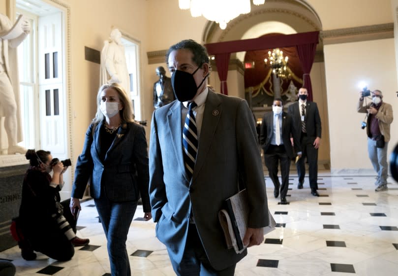 House Impeachment Managers Rep. Jamie Raskin (D-MD) (R) and Rep. Madeleine Dean (D-PA) wear protective masks