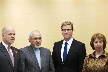 (L-R) British Foreign Secretary William Hague, Iranian Foreign Minister Mohammad Javad Zarif, Germany's Foreign Minister Guido Westerwelle and EU foreign policy chief Catherine Ashton attend the third day of closed-door nuclear talks at the Intercontinental Hotel in Geneva November 9, 2013. REUTERS/Jean-Christophe Bott/Pool