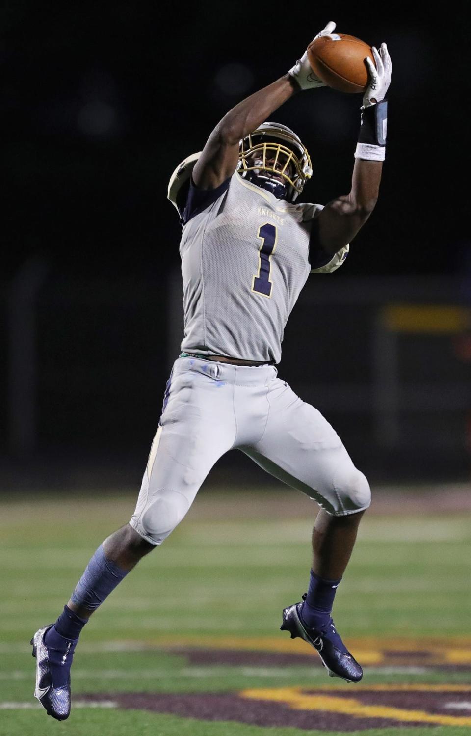 Hoban senior AJ Kirk intercepts a pass thrown by Walsh quarterback Matt Natale during the second half of a football game at Walsh Jesuit High School, Thursday, Oct. 1, 2020, in Cuyahoga Falls, Ohio. [Jeff Lange/Beacon Journal]