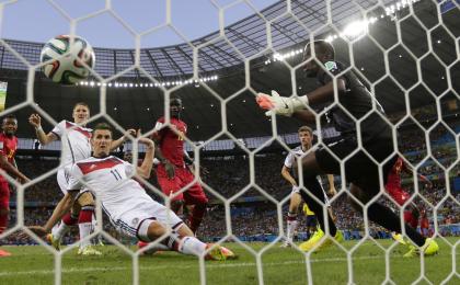 Miroslav Klose's sliding strike against Ghana tied him with Brazil's Ronaldo for most World Cup goals scored. (AP)