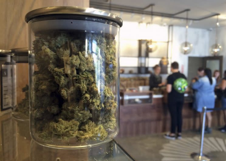 Customers purchase products at the Harvest Medical Marijuana Dispensary in San Francisco, April 2016. (Photo: Haven Daley/AP)