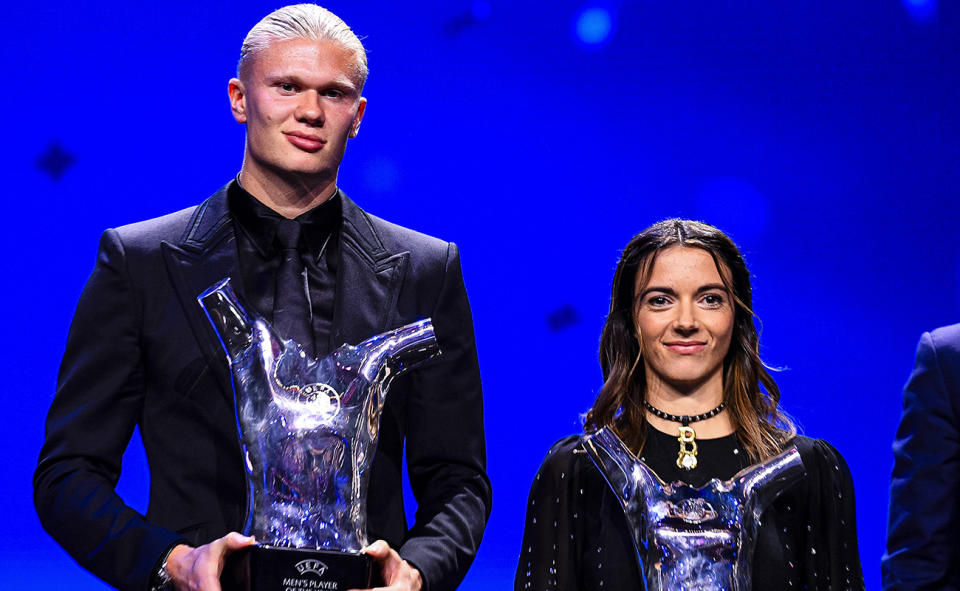 Erling Haaland and Aitana Bonmati­ with their UEFA player of the year awards. (Photo by Marcio Machado/Eurasia Sport Images/Getty Images)