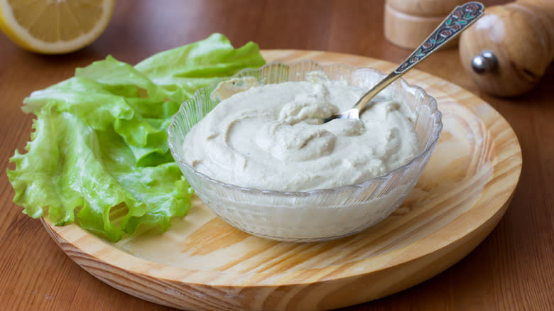 tofu mayonnaise in bowl on wooden plate