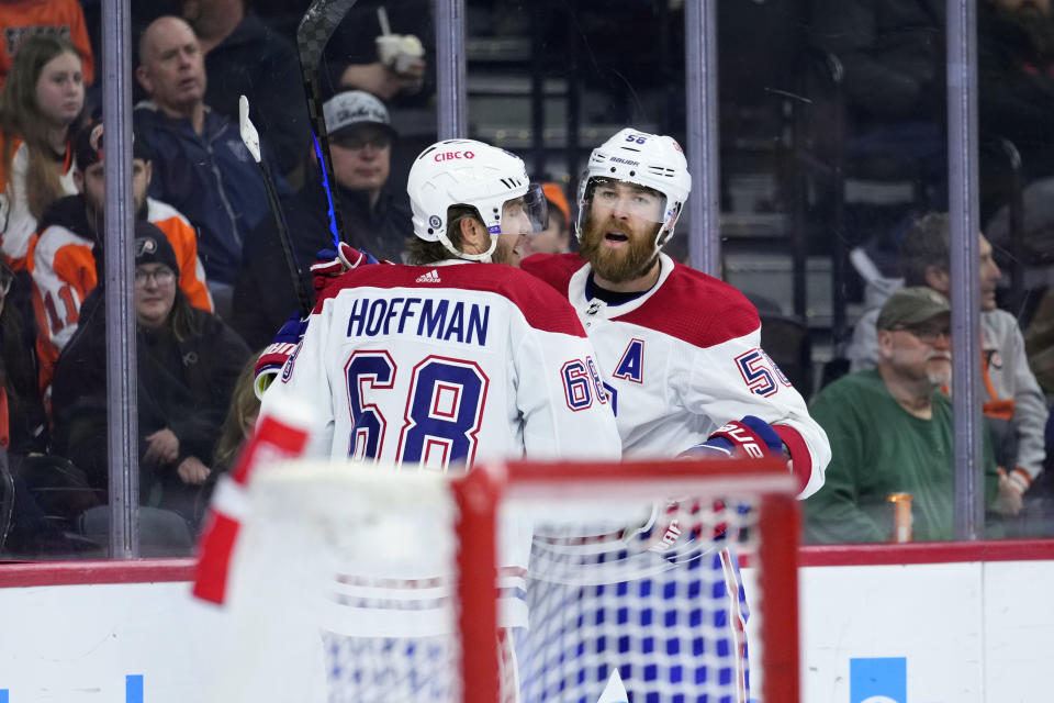 Montreal Canadiens' David Savard, right, and Mike Hoffman celebrate after Savard's goal during the first period of an NHL hockey game against the Philadelphia Flyers, Friday, Feb. 24, 2023, in Philadelphia. (AP Photo/Matt Slocum)